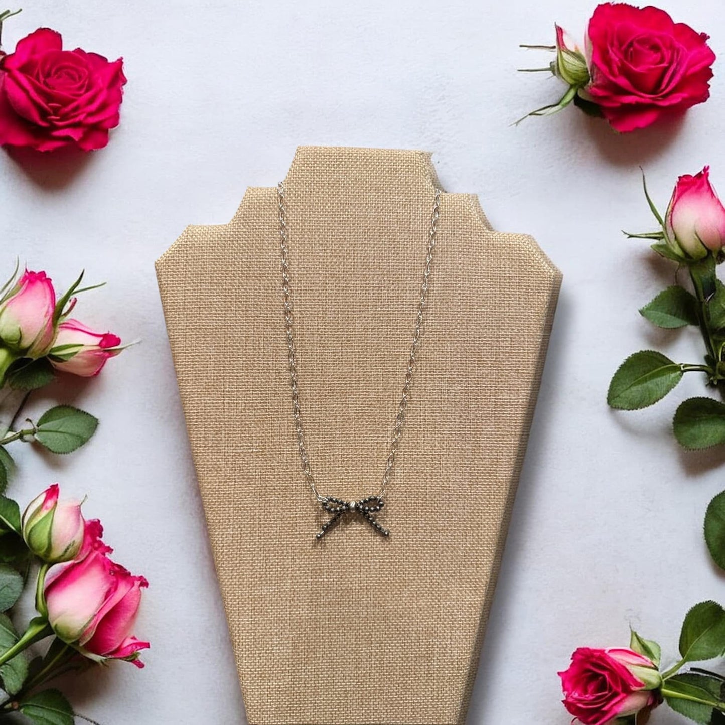 Sterling silver bow necklace with 16” silver plated chain