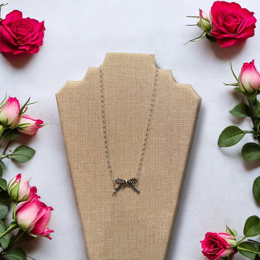 Sterling silver bow necklace with 16” silver plated chain