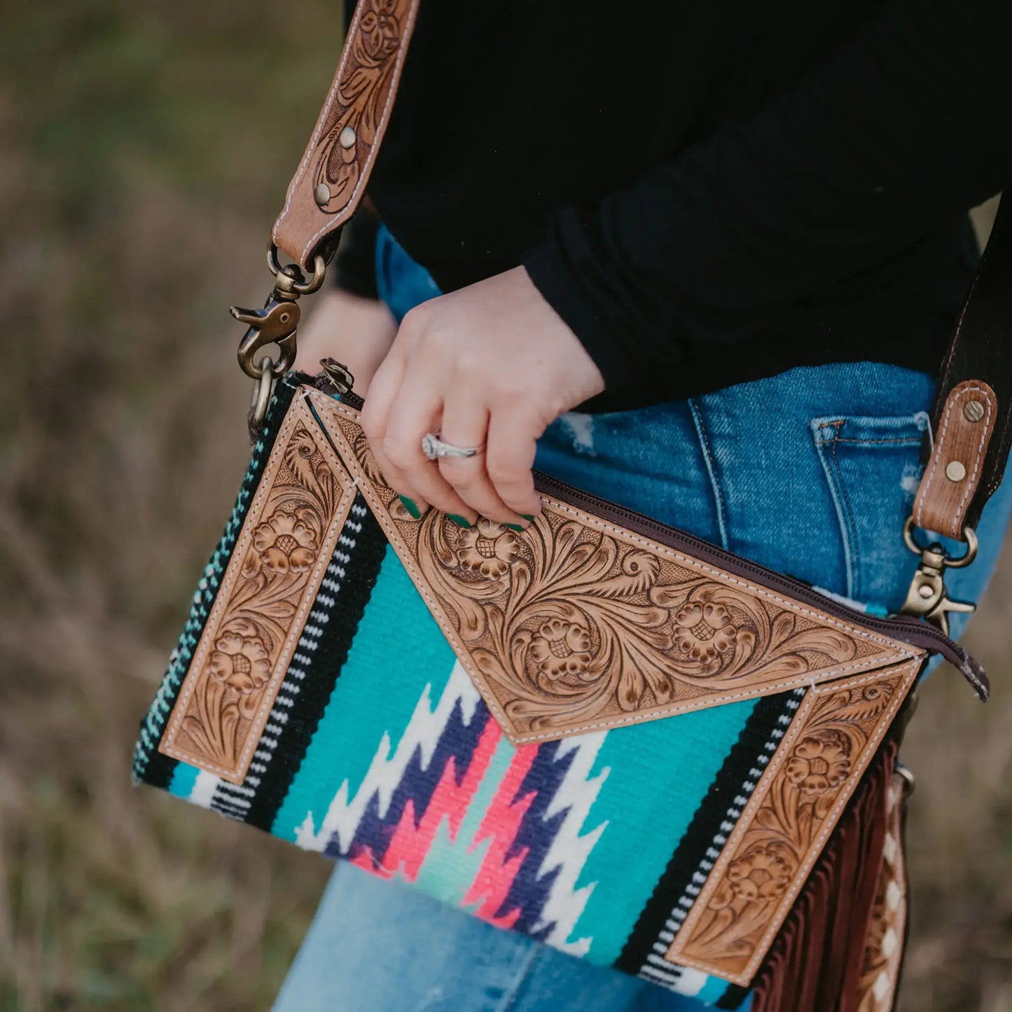 Saddle blanket bag with tooled leather 