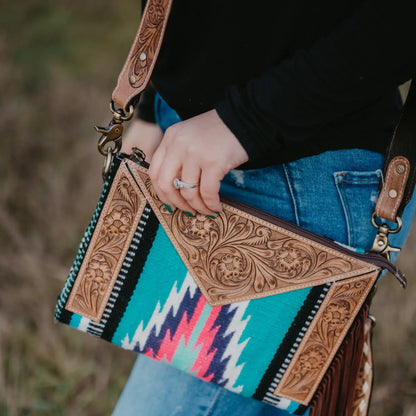 Saddle blanket bag with tooled leather 